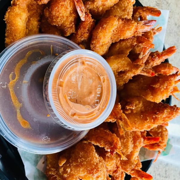 Crispy fried shrimp with two dipping sauces, one orange and one brown, from vPho Westfield.